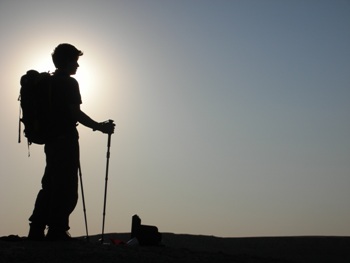 This photo of a backpacking hiker silhouetted against the sun was taken by photographer Angela Granger of Lyons, Oregon.